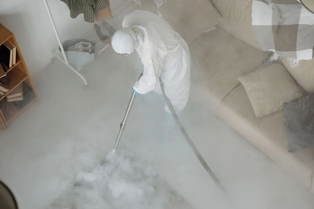 Biohazard cleanup technician in protective equipment, Camp Barrett, VA